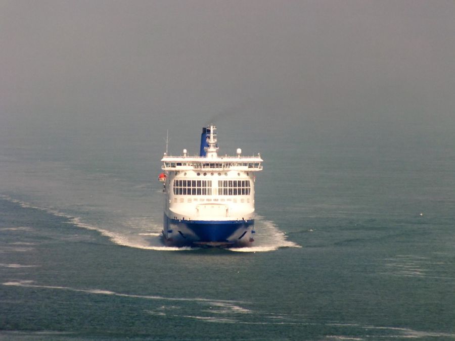 A cross-Channel ferry coming towards the camera in a calm sea.